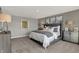Spacious main bedroom featuring neutral colors, stylish furniture, and ample natural light at 4040 Jacoby Pl, Indianapolis, IN 46268