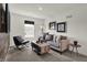 Comfortable living room featuring a stylish sofa, chair, and contemporary decor at 4046 Jacoby Pl, Indianapolis, IN 46268