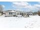 Expansive backyard featuring a sunroom, perfect for relaxing and enjoying the outdoor space, even in winter at 4501 N Wheeling Ave # 10A-101, Muncie, IN 47304