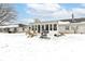 Spacious backyard featuring a patio, grill, and plenty of space for outdoor activities in a snowy landscape at 4501 N Wheeling Ave # 10A-101, Muncie, IN 47304