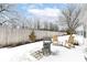 Backyard with a grill and outdoor seating on a stone patio surrounded by a wood fence at 4501 N Wheeling Ave # 10A-101, Muncie, IN 47304