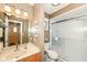 Bathroom with a single sink vanity, toilet, and glass-enclosed shower stall at 4501 N Wheeling Ave # 10A-101, Muncie, IN 47304