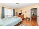 Bright primary bedroom with neutral paint, wood floors, and a sitting area at 4501 N Wheeling Ave # 10A-101, Muncie, IN 47304