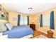 Cozy bedroom with natural light, wood floors, and two closets at 4501 N Wheeling Ave # 10A-101, Muncie, IN 47304