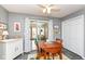 Dining area with a wood table and chairs, sliding glass door with backyard views and natural light at 4501 N Wheeling Ave # 10A-101, Muncie, IN 47304