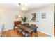 Bright dining area with a modern light fixture and hardwood floors at 4501 N Wheeling Ave # 10A-101, Muncie, IN 47304