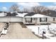 Charming single-story home with a white brick facade and a spacious driveway at 4501 N Wheeling Ave # 10A-101, Muncie, IN 47304