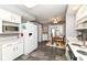 Bright kitchen featuring white cabinetry, modern appliances, and an eat-in area at 4501 N Wheeling Ave # 10A-101, Muncie, IN 47304