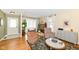Cozy living room with bright windows, a sitting area, and hardwood flooring at 4501 N Wheeling Ave # 10A-101, Muncie, IN 47304