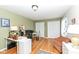 Comfortable home office with hardwood flooring, neutral walls, and good light at 4501 N Wheeling Ave # 10A-101, Muncie, IN 47304