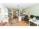 Comfortable home office featuring built in book cases, hard wood floors, and good lighting at 4501 N Wheeling Ave # 10A-101, Muncie, IN 47304