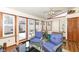 Comfortable sunroom featuring a vaulted ceiling, hardwood floors, and natural lighting at 4501 N Wheeling Ave # 10A-101, Muncie, IN 47304