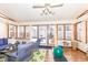 Bright sunroom features hardwood flooring, lots of light, and access to the back yard at 4501 N Wheeling Ave # 10A-101, Muncie, IN 47304