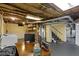 Basement with laundry area, desk, and easy access to the stairs at 4805 N Park Ave, Indianapolis, IN 46205