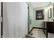 Bathroom featuring a shower with a white curtain, a window with wood trim, and a dark wood vanity at 4805 N Park Ave, Indianapolis, IN 46205