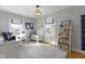 Bedroom featuring a white crib, bookshelves, a window with a view, and light grey carpet at 4805 N Park Ave, Indianapolis, IN 46205