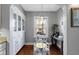 Cozy dining area features built-in cabinets, play kitchen, and hardwood floors at 4805 N Park Ave, Indianapolis, IN 46205