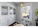 Charming dining area with built-in cabinets, a play kitchen, and a window view at 4805 N Park Ave, Indianapolis, IN 46205