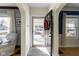 Warm entryway featuring hardwood floors and charming arched doorways into the living spaces at 4805 N Park Ave, Indianapolis, IN 46205