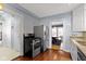 Functional kitchen with stainless steel appliances, hardwood floors, and an open layout at 4805 N Park Ave, Indianapolis, IN 46205