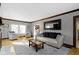 Bright living room with hardwood floors, a neutral rug, and comfortable seating at 4805 N Park Ave, Indianapolis, IN 46205