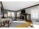 Cozy living room features a fireplace with built-in bookshelves, hardwood floors, and natural light at 4805 N Park Ave, Indianapolis, IN 46205