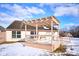 Backyard wooden deck with white railings and pergola offers scenic views at 4912 Eagle Talon Ct, Indianapolis, IN 46254