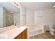 Bathroom featuring double sinks, bathtub, toilet and tile flooring at 4912 Eagle Talon Ct, Indianapolis, IN 46254