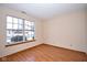 Cozy bedroom features wood floors, bright window, and natural light at 4912 Eagle Talon Ct, Indianapolis, IN 46254