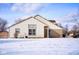 A view of the home exterior shows siding, brick, a manicured lawn, mature trees, and blue skies above at 4912 Eagle Talon Ct, Indianapolis, IN 46254