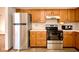 Traditional kitchen with wooden cabinetry, stainless steel appliances and functional layout at 4912 Eagle Talon Ct, Indianapolis, IN 46254