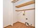 Functional laundry room with wooden floors, providing a practical space for laundry tasks at 4912 Eagle Talon Ct, Indianapolis, IN 46254