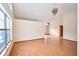 Open concept living area filled with light, vaulted ceilings, and laminate wood flooring at 4912 Eagle Talon Ct, Indianapolis, IN 46254