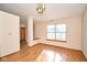Cozy living area with natural light, wood floors, neutral paint, and open access to other rooms at 4912 Eagle Talon Ct, Indianapolis, IN 46254