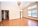 Spacious living room with vaulted ceilings, wood floors, and lots of natural light at 4912 Eagle Talon Ct, Indianapolis, IN 46254