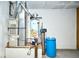 The utility room with hot water tank and water filter provides essential home systems at 4912 Eagle Talon Ct, Indianapolis, IN 46254