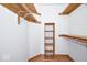 Walk-in closet with wood accents and built in shelving at 4912 Eagle Talon Ct, Indianapolis, IN 46254