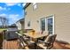 View of back deck furnished with comfortable patio table, chairs and grill at 5147 Nicodemus Dr, Plainfield, IN 46168