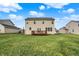 Exterior elevation of home and backyard with deck, lawn, and mature trees at 5147 Nicodemus Dr, Plainfield, IN 46168