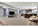 Finished basement with a bar, foosball table, and large TV at 5147 Nicodemus Dr, Plainfield, IN 46168