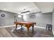 Finished basement with pool table, bar, and dark wood-look floors at 5147 Nicodemus Dr, Plainfield, IN 46168