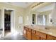 Bathroom with double sinks, toilet, large mirrors, and ample cabinet space at 5147 Nicodemus Dr, Plainfield, IN 46168