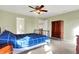 Bedroom showcases a bed, ceiling fan, carpet, and natural light from the window at 5147 Nicodemus Dr, Plainfield, IN 46168