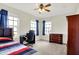 Sunlit bedroom with dual windows, ceiling fan, desk and dresser at 5147 Nicodemus Dr, Plainfield, IN 46168
