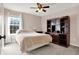Bedroom featuring neutral colored walls, built-in bookshelf, carpet, and natural light from the window at 5147 Nicodemus Dr, Plainfield, IN 46168