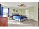 Bedroom showcases a bed, ceiling fan, carpet, and natural light from the window at 5147 Nicodemus Dr, Plainfield, IN 46168