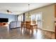 Open dining area adjacent to the living room with natural light and hardwood floors at 5147 Nicodemus Dr, Plainfield, IN 46168
