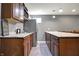An eat-in kitchen is fitted with stainless steel appliances, attractive cabinetry and luxury countertops at 5147 Nicodemus Dr, Plainfield, IN 46168