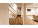 Finished basement featuring modern flooring, a staircase, and recessed lighting at 5715 N Delaware St, Indianapolis, IN 46220