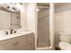 Modern bathroom featuring stylish vanity, sleek fixtures, and glass shower at 5715 N Delaware St, Indianapolis, IN 46220